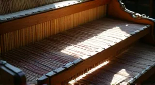 Shadows of the Loom: Weaving Intergenerational Trauma into Regional Narratives